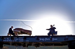 The Piano Guys filming a music video on top of a moving train | Photo courtesy of The Piano Guys