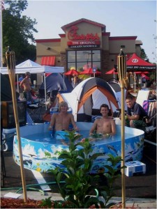 sample parking lot tent shot with pool for cfa grand opening