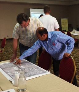 Wade on the left discussing the interchange construction with Raj Patel the General Manager of the Ramada Inn, St. George, Utah, June 27, 2013 | Photo by Jason Little, St. George News