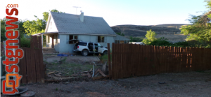 Vehicle hit-and-run at 150 East 600 North, driver crashed through the fence and against the house and abandoned the vehicle. Hurricane, Utah, June 26, 2013 | Photo by Christina DeMille, St. George News