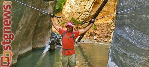 Blind adventurer Erik Weihenmayer hiking through the Zion Narrows. The entrance to the Narrows has been protected by the Trust for Public Land. Zion National Park, Utah, date not provided | Photo courtesy of The Trust for Public Land, PRNewsFoto