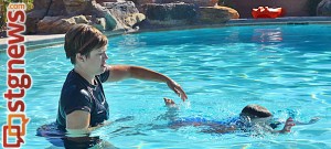 Infant Swim instructor Robyn Lamoreaux and Finn Reid, 3, practice survival swimming, Santa Clara, Utah, July 31, 2013 | Photo courtesy of Robyn Lamoreaux