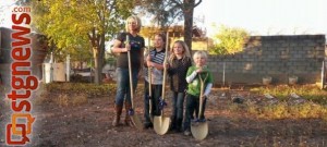 Candice Nay and her children pose in their new backyard as part of Habitat for Humanity's ceremony for them, Washington City, Utah, Nov. 26, 2013 | Photo by Drew Allred, St. George News