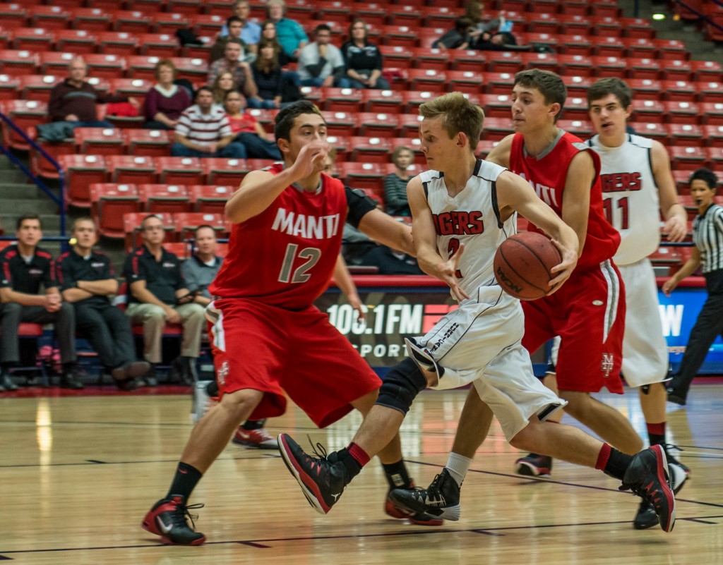 Hurricane junior James Bennion dribbles in heavy traffic, Hurricane vs. Manti, Red Rock Rumble, St. George, Utah, Dec. 19, 2013 | Photo by Dave Amodt, St. George News