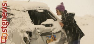 Kember Childers inspects the damage to her Pontiac Vibe after a slide-out on Red Hills Parkway, St. George, Utah, Dec. 7, 2013 | Photo by John Teas, St. George News