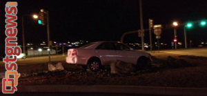 Car comes to rest on traffic island near Dixie Drive interchange with I-15, St. George, Utah, Dec. 226, 2013 | Photo by Michael Flynn, St. George News