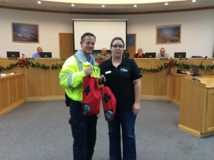 Hurricane Fire/EMS representative Nick Wright and Because Animals Matter President September Smith, Hurricane, Utah, Dec. 20, 2013 | Photo by Beth Lock, St. George News 