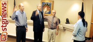 (L-R) Ivins Councilman Cheyne McDonald, Mayor Chris Hart and Councilman Steven Roberts are sworn in by Ivins City Clerk/Recorder Kari Jimenez, Ivins, Utah, Jan. 2, 2014 | Photo courtesy of Dale Coulam