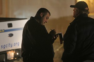 A police officer takes a statement from a man at the scene on West Snow Canyon Parkway, St. George, Jan 30, 2014 | Photo by John Teas, St. George News