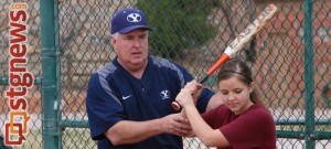 Coach Gordon Eakin teaching a young girl batting at the BYU Softball clinic, St. George, Utah, Feb. 8, 2014 | Photo by John Teas, St. George News