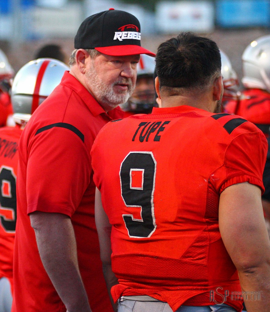 Coach Dale Stott and quarterback Misi Tupe discuss game strategy, Wasatch Revolution at Dixie Rebels, St. George, Utah, Apr. 5, 2014 | Photo by Robert Hoppie, St. George News