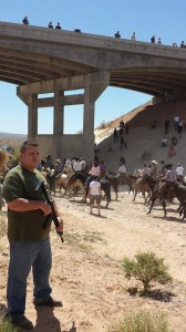 Bundy family, supporters and civilian militia at the overpass demanding the BLM to release the cattle, Clark County, Nev., April 12, 2014 | Photo courtesy of MaryBeth Greenwalt, St. George News