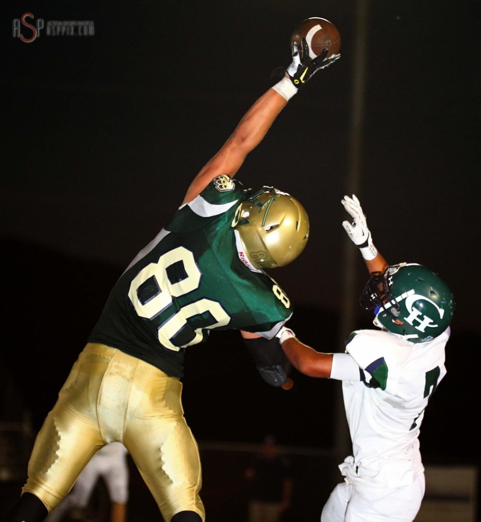 Chance Thorkelson reaches high to catch a pass, Snow Canyon vs Copper Hills, St. George, Utah, August 22, 2014 | Photo by Robert Hoppie, ASPpix.com, St. George News