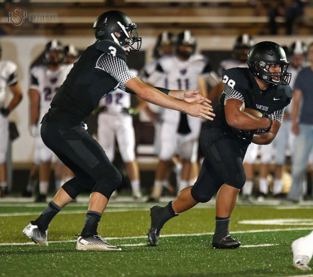 Kody Wilstead hands off to Pano Tiatia, Lehi at Pine View, St. George, Utah, September 5, 2014 | Photo by Robert Hoppie, ASPpix.com, St. George News