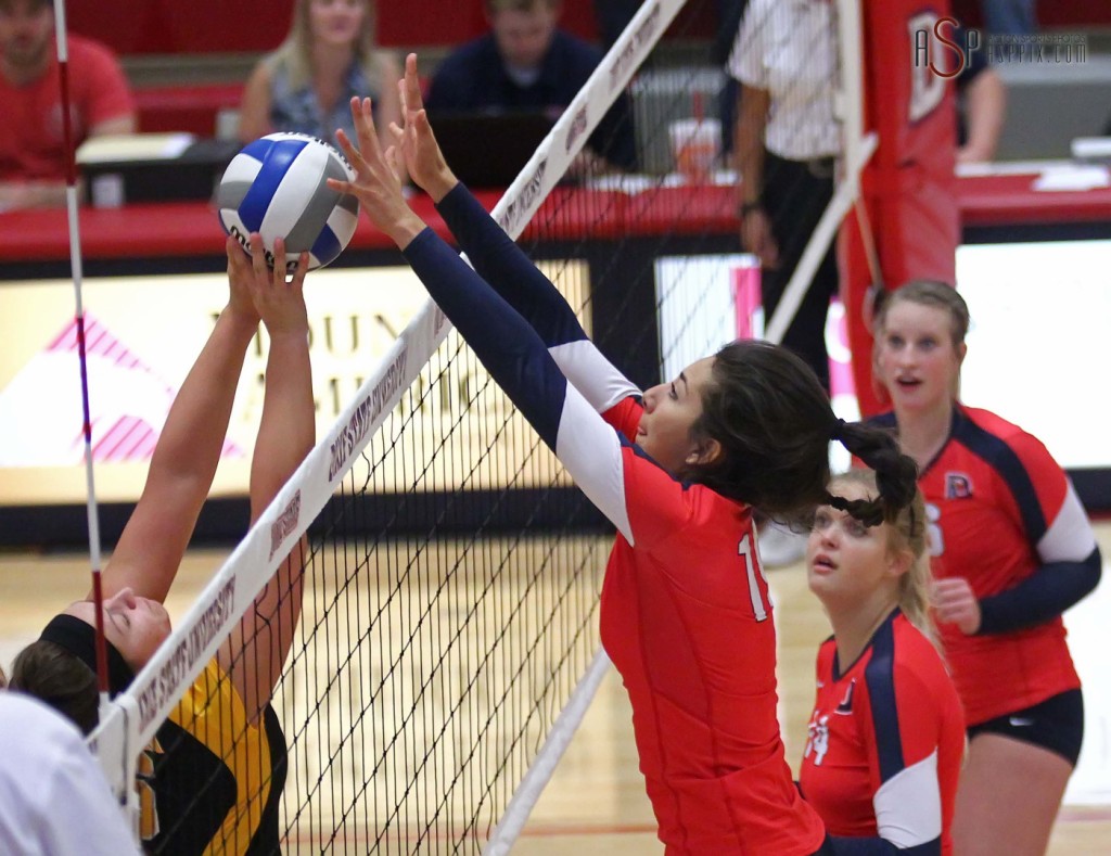 Edithza Urias blocks a Dominican players volley, Dixie State University vs. Dominican University, St. George, Utah, September 20, 2014 | Photo by Robert Hoppie, ASPpix.com, St. George News
