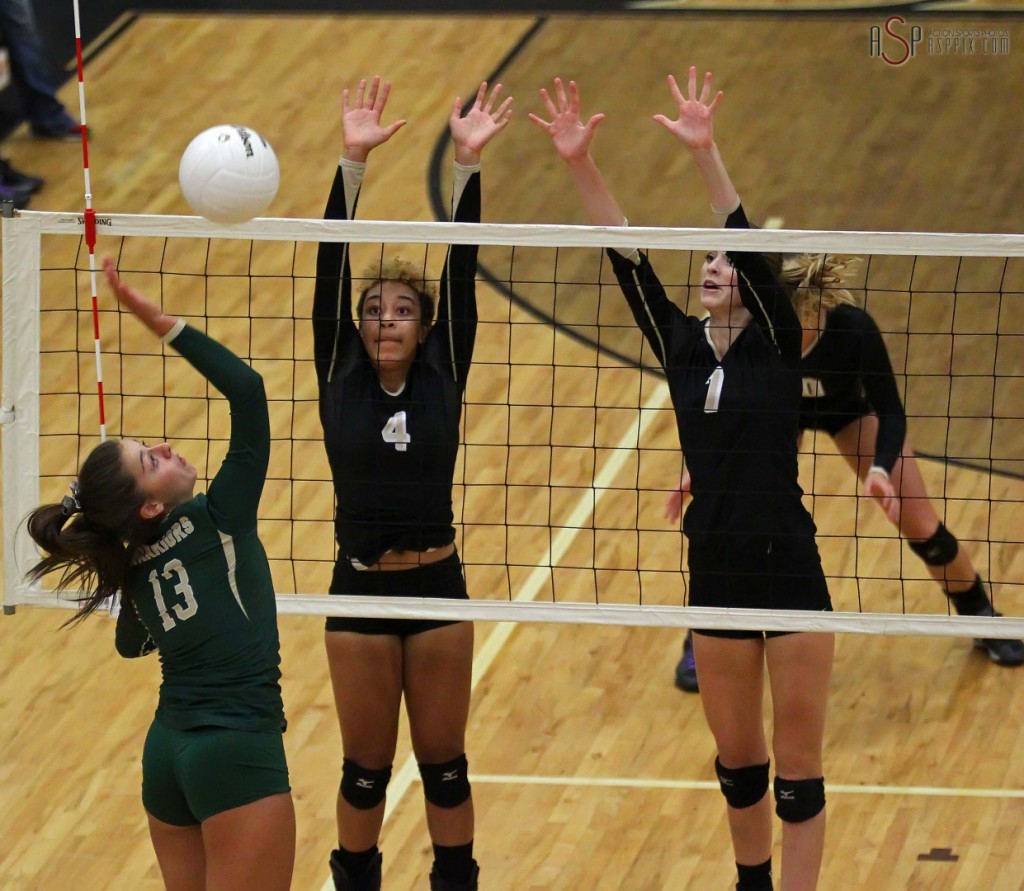 Snow Canyons Alexsa "Crash" Parker fires a shot into Desert Hills Defenders Olivia Leavitt (4) and Rachel Winters, Snow Canyon vs Desert Hillsl, St. George, Utah, Sept. 23, 2014 | Photo by Robert Hoppie, ASPpix.com, St. George News