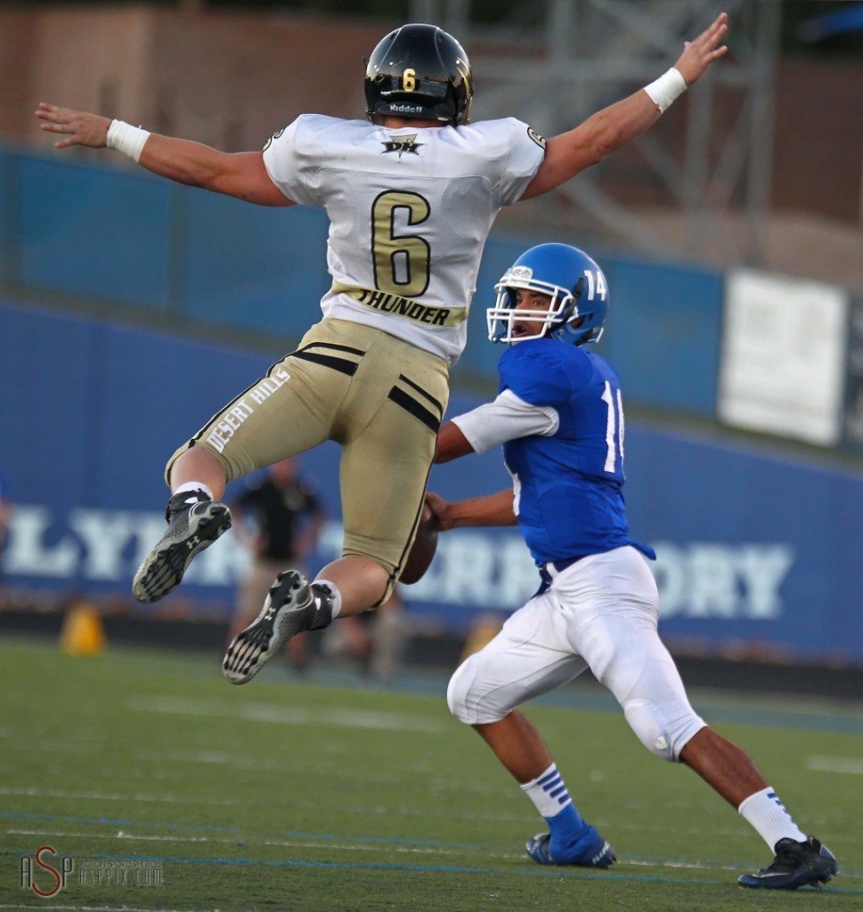 Desert Hills LB Tucker Cowdin (6) puts pressure on Dixie QB Ammon Takau, Dixie vs. Desert Hills, St. George, Utah, Oct. 3, 2014 | Photo by Robert Hoppie, ASPpix.com, St. George News