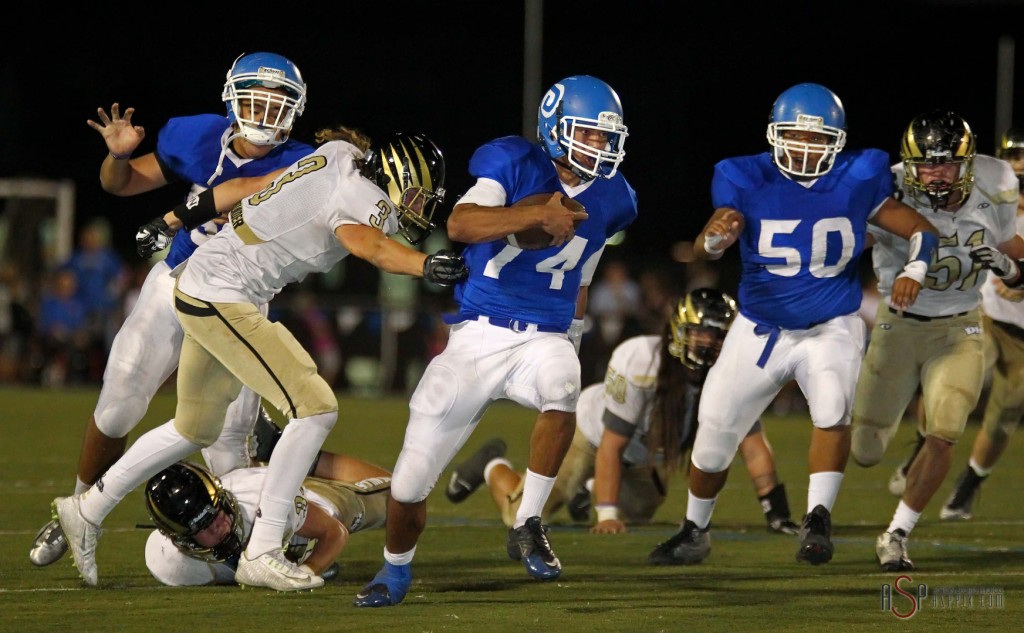 Dixie QB Ammon Takau breaks out of a tackle, Dixie vs. Desert Hills, St. George, Utah, Oct. 3, 2014 | Photo by Robert Hoppie, ASPpix.com, St. George News