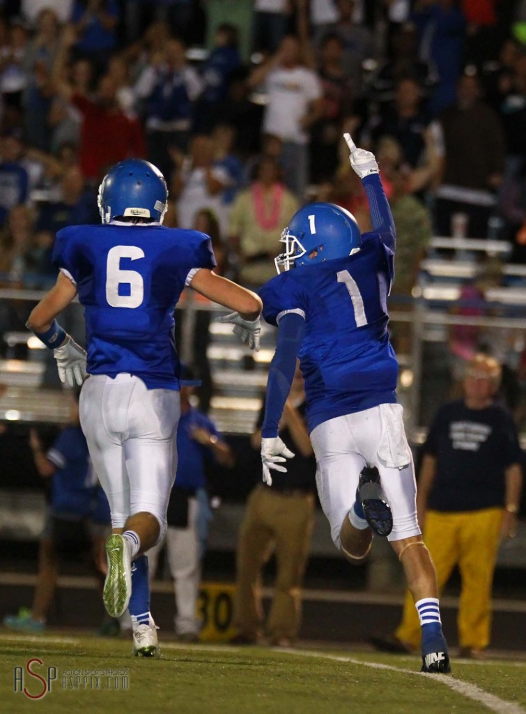 RJ Wilgar (1) and Jaden Harrison (6) celebrate the Flyers victory over the Thunder, Dixie vs. Desert Hills, St. George, Utah, Oct. 3, 2014 | Photo by Robert Hoppie, ASPpix.com, St. George News