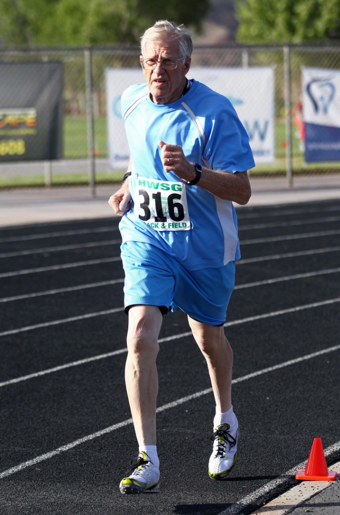 Dale Perkins rounds the corner during the 1500-meter race at the Huntsman Senior Games Track and Field event, St. George, Utah, Oct. 8, 2014 | Photo by Robert Hoppie, ASPpix.com, St. George News