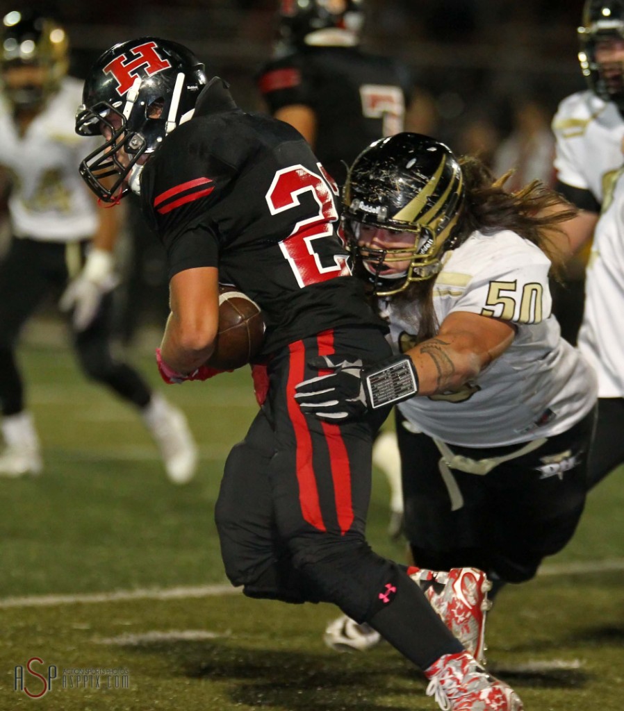 Thunder defender Justice Alo tackles a Hurricane ball carrier, Desert Hills vs. Hurricane,  St. George, Utah, Oct. 24, 2014 | Photo by Robert Hoppie, ASPpix.com, St. George News