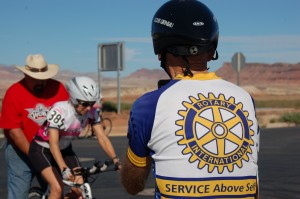 Walt Schafer photographs his wife, Teresa Kludt before she takes off from the start line of the time trials portion of the cycling competition in the Huntsman World Senior Games, St. George, Utah, Oct. 8, 2014 | Photo by Hollie Reina, St. George News