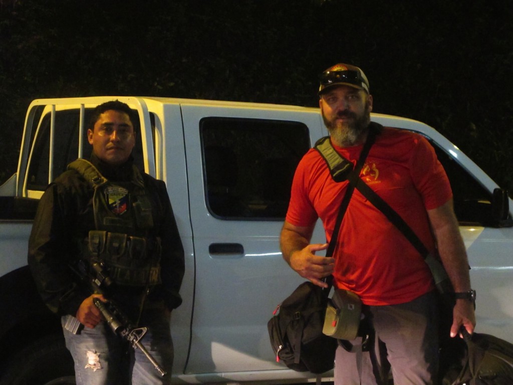 Photojournalist Dallas Hyland with unnamed armed Colombian government escort. The entire team was escorted to the airport for their protection after the busts went down, Oct. 2014 | Photo courtesy of Dallas Hyland, St. George News