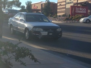 A Toyota Camry sustains front bumper damage after the driver fails to yield to oncoming traffic, St. George, Utah, Oct. 2, 2014 | Photo by Holly Coombs, St. George News