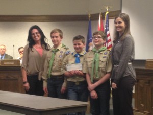 Boy Scout Troop 1865 stands with Sphere One Aviation Owner Brenda Blackburn and Cedar City Mayor Maile Wilson after they were presented with a check of $1,383 from Sphere One Aviation for their help with a fly-in breakfast, Cedar City, Utah, Oct. 8, 2014 | Photo by Holly Coombs, St. George NewsThe fly-in breakfast was an event put on for the public to attend and for local pilots to fly into the Cedar City Airport by plane and enjoy a catered breakfast. 
