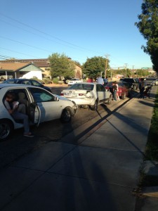 Four cars line the street of 700 South after being involved in an accident that caused damage to each car, St. George, Utah, Oct. 28, 2014 | Photo by Holly Coombs, St. George News