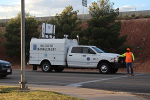 A Utah Department of Transportation worker  directing traffic after an accident at the intersection of Red Cliffs Drive and 1680 East on Oct. 9, 2014 | Photo by Devan Chavez, St. George News 