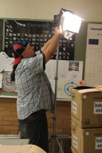 Haven Scott, Key Grip for "Triangle Power," prepares some set lights for production in Cedar City High School on Oct. 14, 2014 | Photo by Devan Chavez, St. George News  