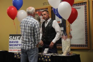 Call Rollins (left), KSUU-FM Station Manager, speaks with Sgt. Dave McIntyre (right) about the debate for Iron County Sheriff at SUU on Oct. 23, 2014 | Photo by Devan Chavez, St. George News