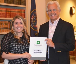 Mishaela, a student at Snow Canyon High School, receives a receives a savings account deposit certificate from Town & Country Bank President and CEO Bruce Jensen, St. George, Utah, Oct. 17, 2014 | Photo courtesy of Brent Bennett, St. George News