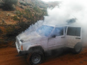 The Jeep Cherokee on fire just south of the intersection of state Route 7 and Sand Hollow Road, Utah, Nov. 2, 2014 | Photo courtesy of Casey Lofthouse, St. George News