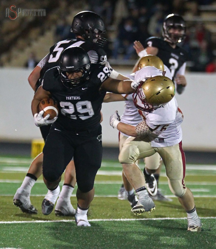 Panther RB Pano Tiatia stiff arms a Cedar defender, Pine View vs. Cedar,  St. George, Utah, Nov. 7, 2014 | Photo by Robert Hoppie, ASPpix.com, St. George News