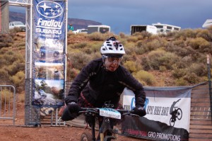 Lynda Wallenfels dismounts after the completion of another lap at the 25 Hours in Frog Hollow endurance mountain bike race, Virgin, Utah, Nov. 2, 2014 | Photo by Hollie Reina, St. George News