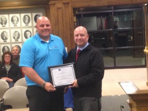 Cedar City Chamber of Commerce President Scott Jolley presents an award he collected on behalf of the city to Economic Development Director Danny Stewart, Cedar City, Utah, Nov. 19, 2014 |Photo by Holly Coombs, St. George News