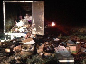 Burnt office supplies spill out of a Swift semi truck trailer after it caught fire on Interstate 15, Kanarraville, Utah, Nov. 19, 2014 |Photo by Holly Coombs, St. George News