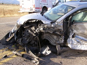 A Buick Enclave sustains severe damage after colliding with a cement truck, Veyo, Utah, Nov. 13, 2014 | Photo courtesy of Utah Highway Patrol, St. George News