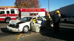 Firefighters work to extricate an 85-year-old woman from her car after she crashed  into two other vehicles in the Smith's parking lot, St. George, Utah, Nov. 18, 2014 | Photo by Mori Kessler, St. George News