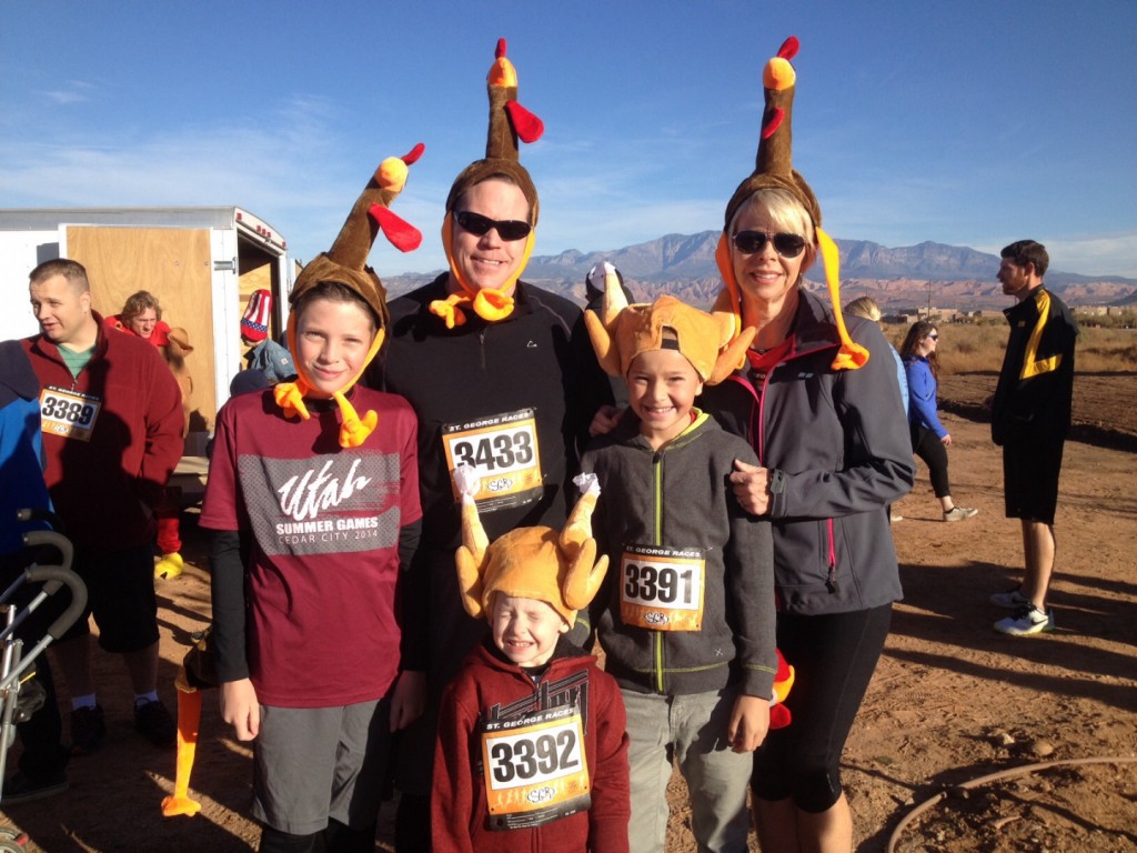 Front row: Lincoln Kelson. Middle Row: Carter Hugunin (L) and Dominic Kelson (R). Back row: Ted Hugunin (L) and Vicki Wilson (R). Family and friends don turkey hats and get set to participate in the Turkey Trot 5K and 1 mile fun run, St. George, Utah, Nov. 22, 2014 | Photo by Hollie Reina, St. George News