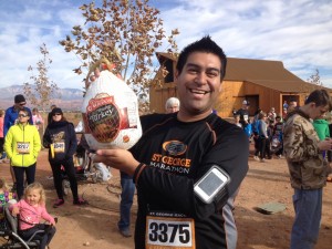 Manny Guarda shows off the turkey he won during the raffle at the Turkey Trot 5K and one mile fun run, St. George, Utah, Nov. 22, 2014 | Photo by Hollie Reina, St. George News