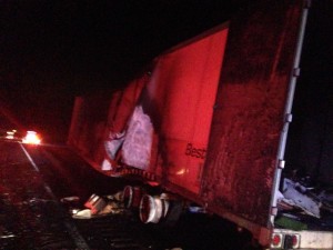 Aftermath of a semi trailer that caught fire shows empty tire axels and a holes in the trailer, which allowed firefighters the access  to spray water and prevent flare ups in the back of the trailer, Kanarraville, Utah, Nov. 19, 2014 |Photo by Holly Coombs, St. George News