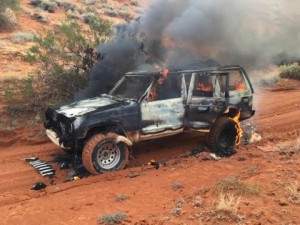 The Jeep Cherokee on fire just south of the intersection of state Route 7 and Sand Hollow Road, Utah, Nov. 2, 2014 | Photo courtesy of Boyd Barney, St. George News