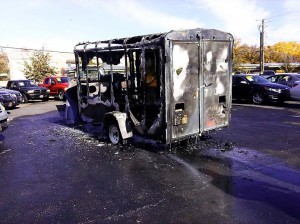 After the fire was extinguished the trailer sits behind Red Rock Auto Sales, located at 176 W. St. George Blvd. in St. George, Utah, Nov. 29, 2014 | Photo by Aspen Stoddard, St. George News