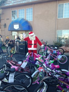 Santa Claus stands with donated toys at the Car Guys Care Toys for Tots Classic Car Show & Shine, St. George, Utah, Dec. 6, 2014 | Photo by Holly Coombs, St. George News