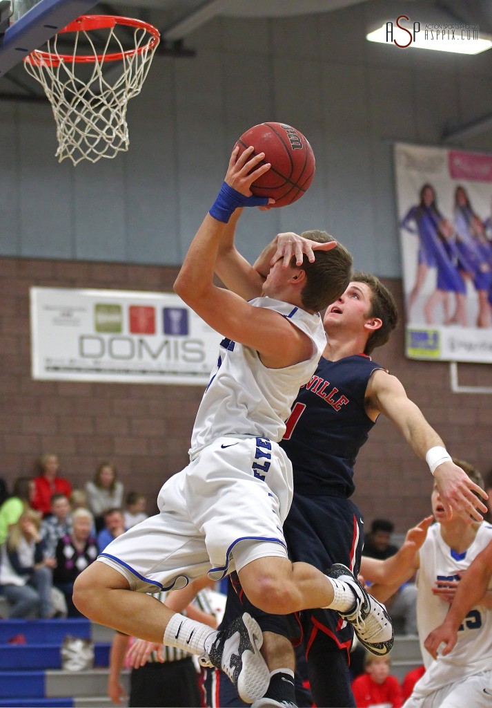 Dixie G RJ Wilgar takes a foul on a layup attempt, Dixie vs. Springville, Boys Basketball, St. George, Utah, Dec. 12, 2014 | Photo by Robert Hoppie, ASPpix.com, St. George News