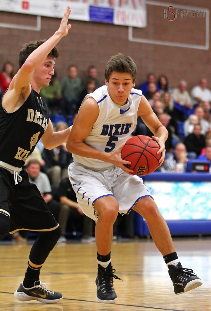 Tyler Bennett (5) drives the lane against Logan Forsyth, Desert Hills vs.Dixie, Boys Basketball, St. George, Utah, Dec. 17, 2014 | Photo by Robert Hoppie, ASPpix.com, St. George News