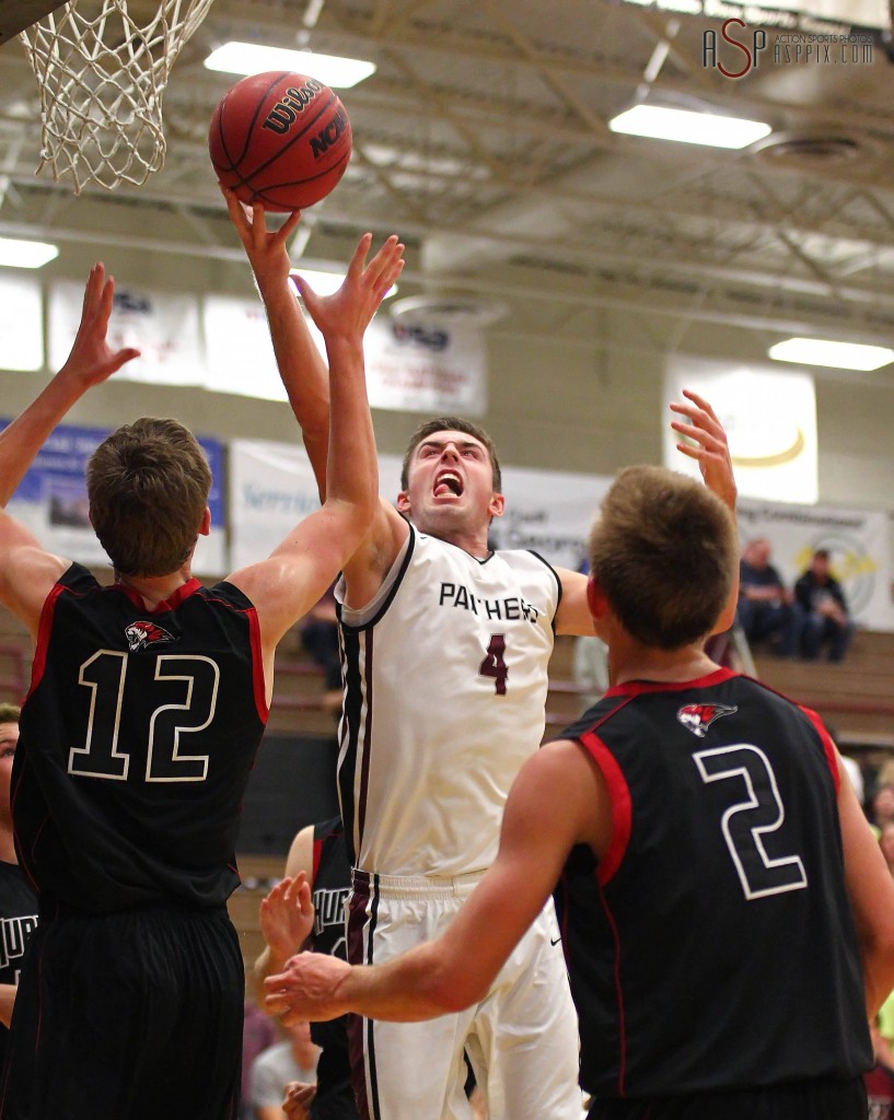 Kody Wilstead (4) grabs a rebound over Reagan Hinton (12) and James Bennion (2), Hurricane vs Pine View, Boys Basketball, St. George, Utah, Dec. 17, 2014 | Photo by Robert Hoppie, ASPpix.com, St. George News